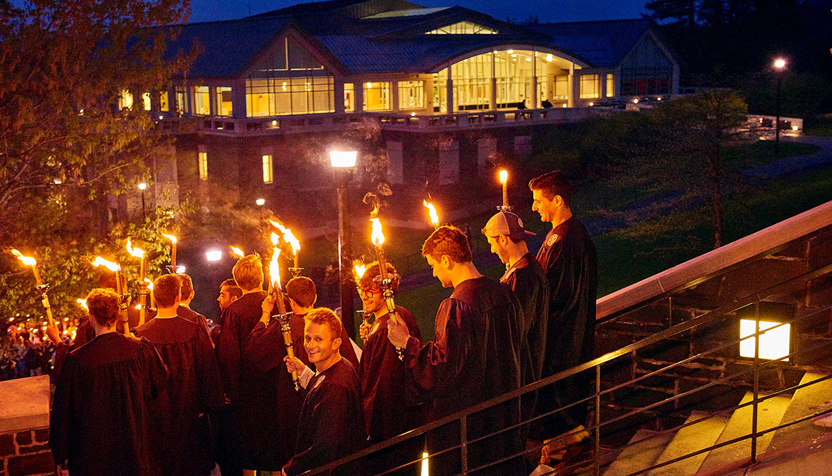 Students descend the Person steps during the Torchlight ceremony