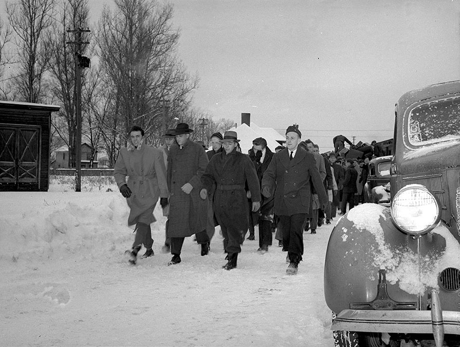 Navy Flight Preparatory School cadets arrive at Hamilton train station during snowstorm, 1943