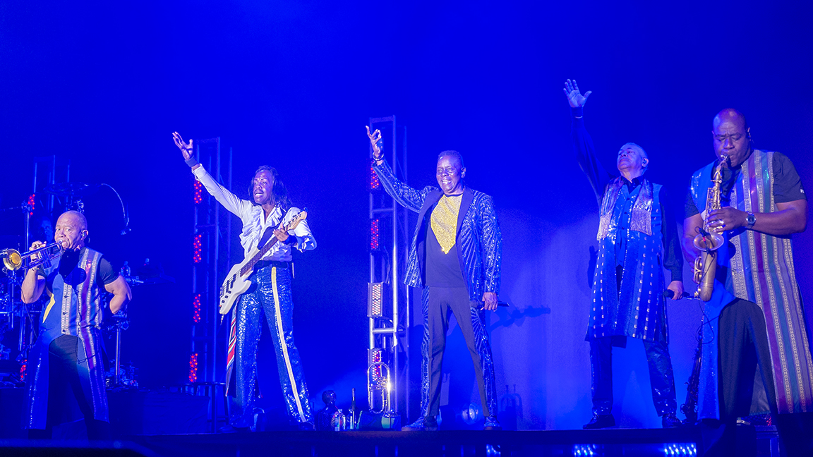 Earth, Wind & Fire band members wave to crowd