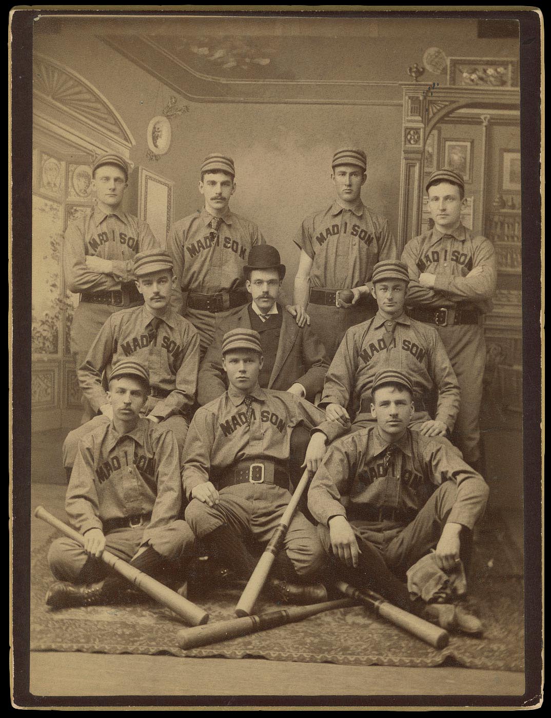 Archival image of students in baseball uniforms