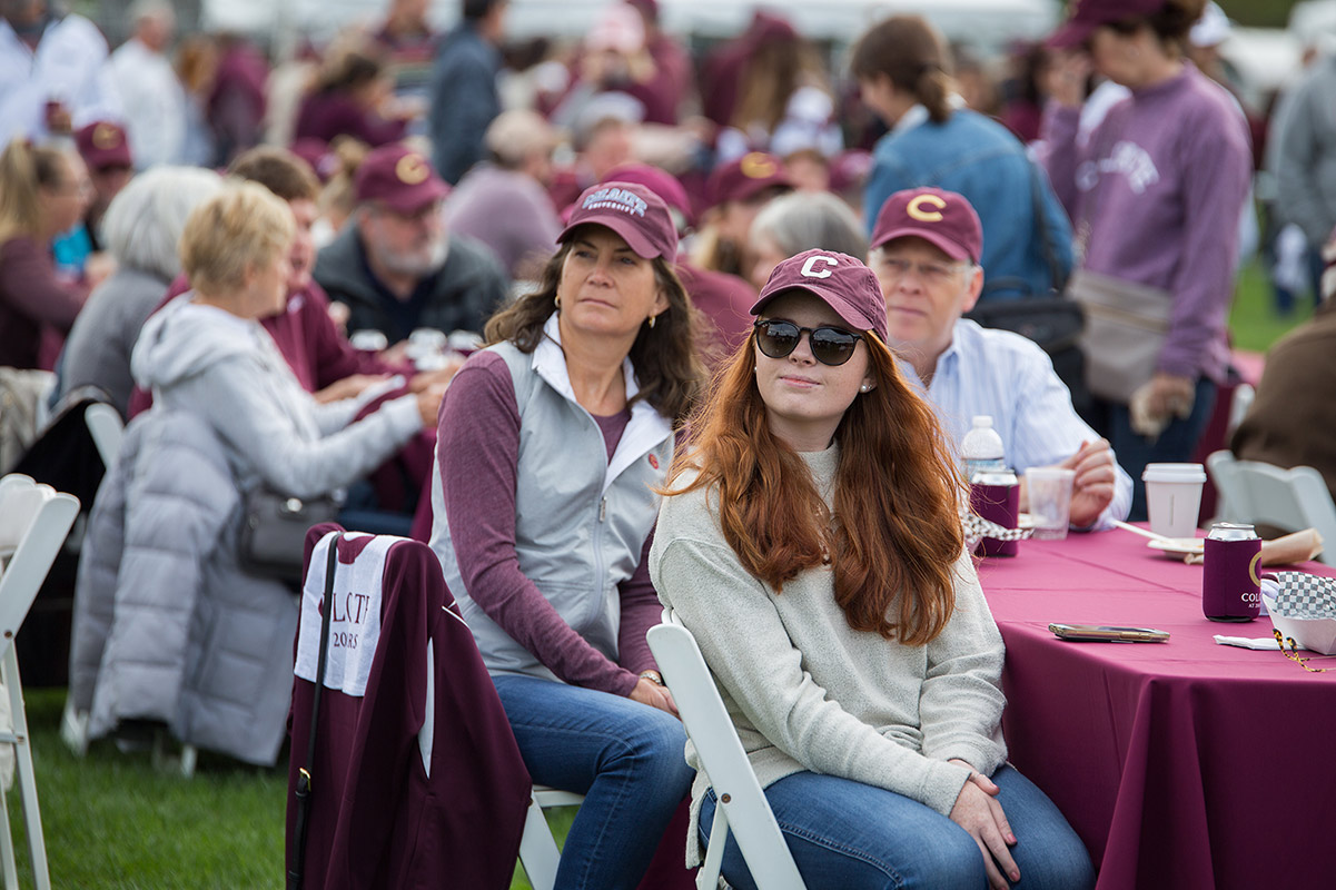 Student and parents in Colgate hats