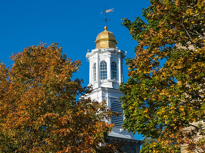 Colgate University's Memorial Chapel amidst autumn foliage