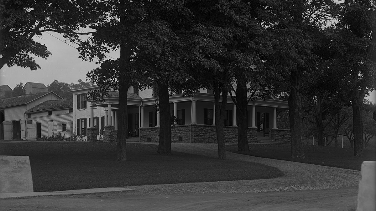 Archival image of the Seven Oaks Clubhouse when it was still a farmhouse